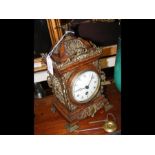 A decorative 26cm high antique mantel clock