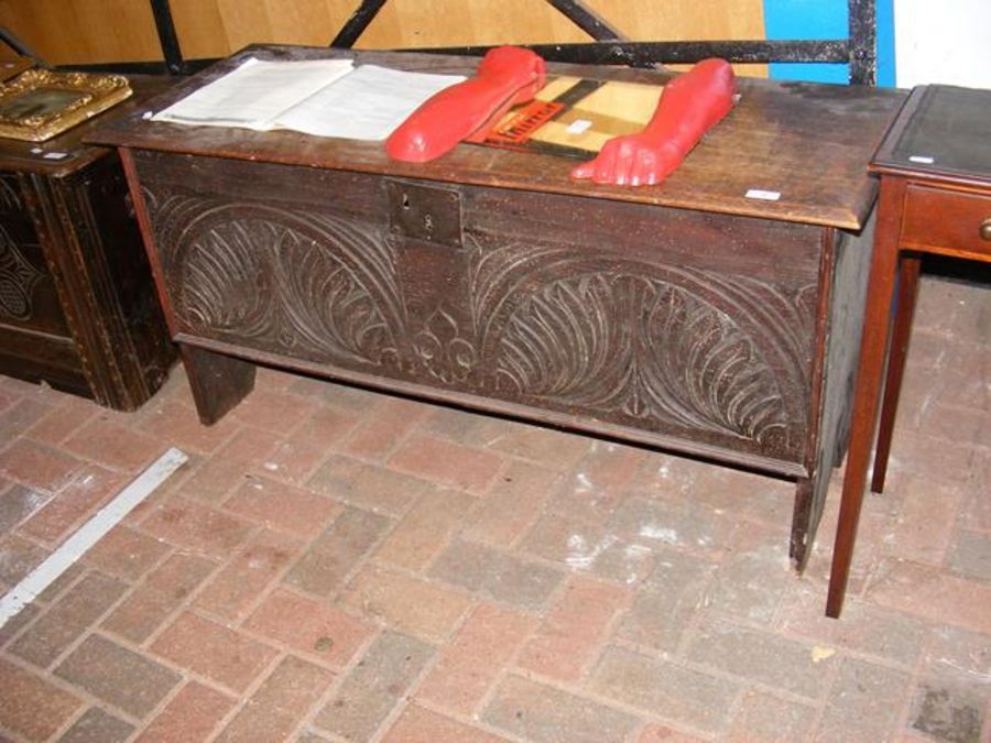 A period oak coffer with carved front - 117cm