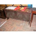 A period oak coffer with carved front - 117cm