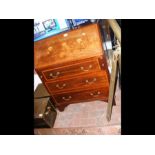 An Edwardian inlaid mahogany bureau with three dra