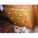 A pine chest of two short and two long drawers - w