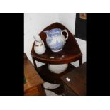 An antique corner washstand with jug and bowl