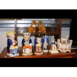 A collection of Staffordshire figures including tr