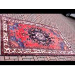 A large North-West Persian rug - 265cm x 165cm