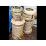 A pair of buff terracotta chimney pots - height 80