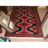An antique Baluch rug from Persia - 190cm x 120cm