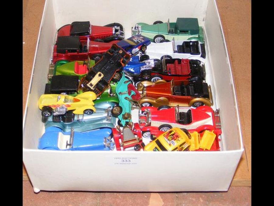 A box of Matchbox die cast vehicles