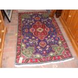 A Middle Eastern rug with geometric border