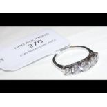A five stone diamond ring in platinum setting with