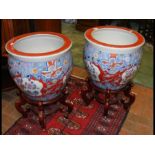 A pair of reproduction Oriental jardinieres on woo