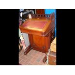 An Edwardian Davenport desk with fitted interior a