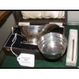 A small silver sauce boat, small silver bowl etc.