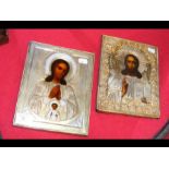 Two Russian Icons in decorative white metal surrou