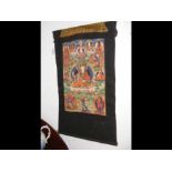 A hand painted textile panel of deities