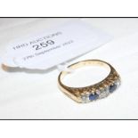 A five stone sapphire and diamond ring in 18ct set