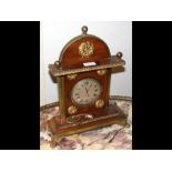 A decorative gilt and wooden mantel clock - 38cm h