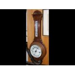 A wall barometer/thermometer