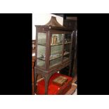 An antique Chippendale style display cabinet of Or