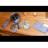 A Smiths dashboard clock, two AA badges etc.