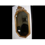 A small decorative gilt hall mirror