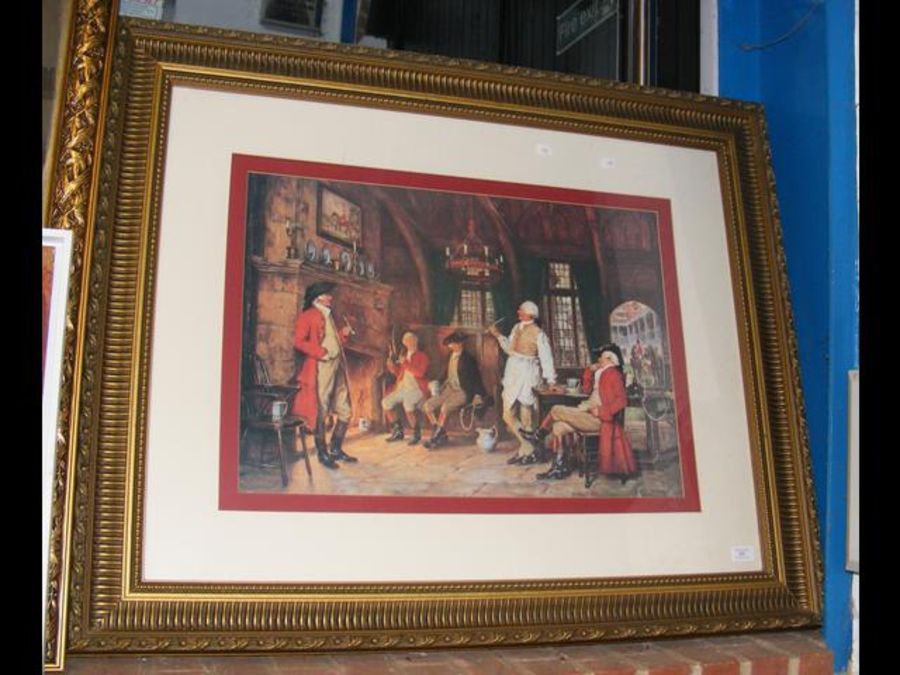 A gilt framed print of fireside scene