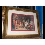 A gilt framed print of fireside scene