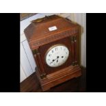 A 42cm high oak cased mantel clock with striking m