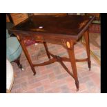 An Edwardian fold over games table