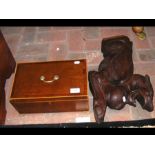 An antique box together with a carved oak griffin figu