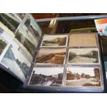 An album containing old collectable postcards rela