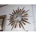 A mid century Metamec Sunburst Wall Clock