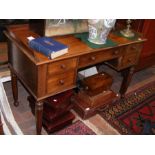 A Victorian mahogany desk with five drawers to the