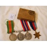 Four Second World War medals in box