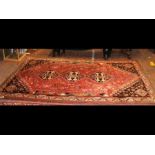 An Iranian carpet with geometric border - 270cm x