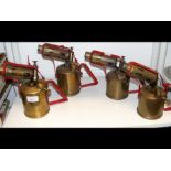 Four brass blowtorches