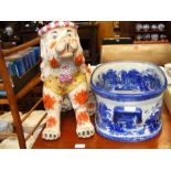 A large ceramic dog, together with blue and white