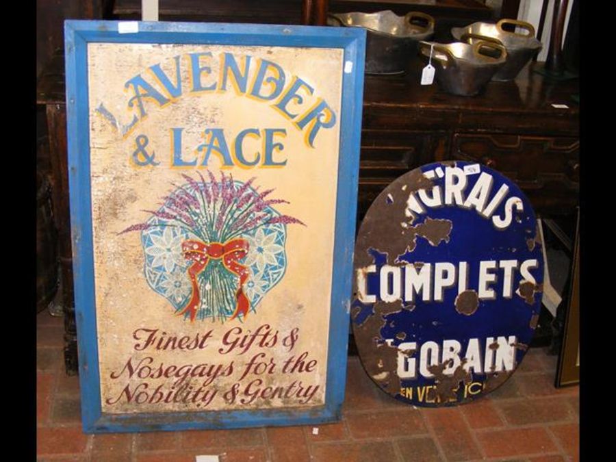 An old enamel sign, together with a wooden 'Lavend