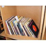 A collection of 45rpm records including Shirley Ba