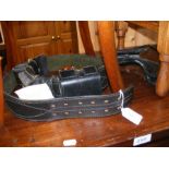 A leather gun belt and holster, etc.