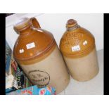 Two stoneware ginger beer bottles, bearing the nam