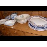 An assortment of antique meat plates and chamber p