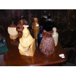 A selection of salt glazed decanters, stoneware bo