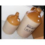 Two stoneware ginger beer bottles, bearing the nam