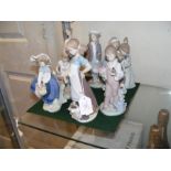 A selection Lladro figures including girl with bir