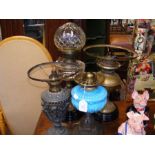 Four antique oil lamps