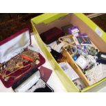 A box of costume jewellery including necklaces, cu