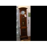 An oak cased two train Grandfather clock with Arts