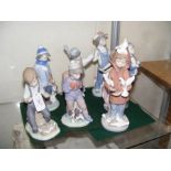 Seven Nao and Lladro figures including boy with do