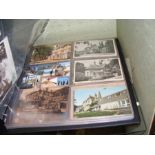 An album containing collectable old postcards, inc