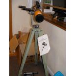 A telescope on stand together with a Solus scope e
